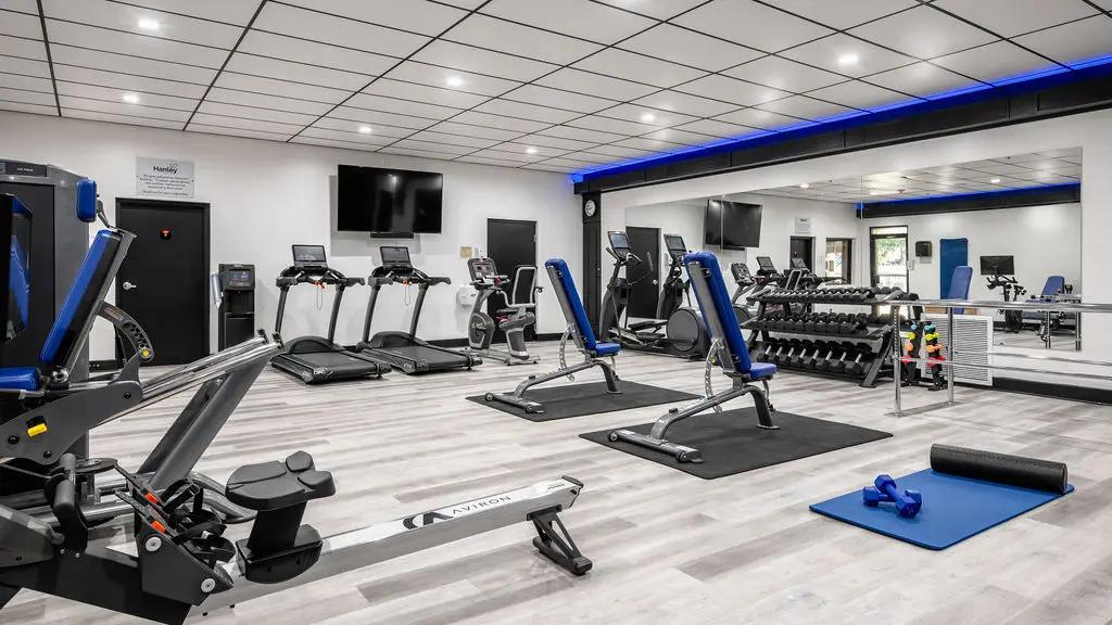 Fitness center with treadmills and free weights
